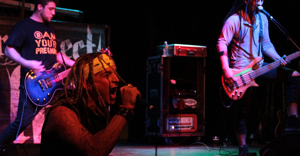 A group of people playing music on stage.