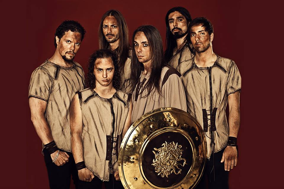 A group of men posing with a golden shield.