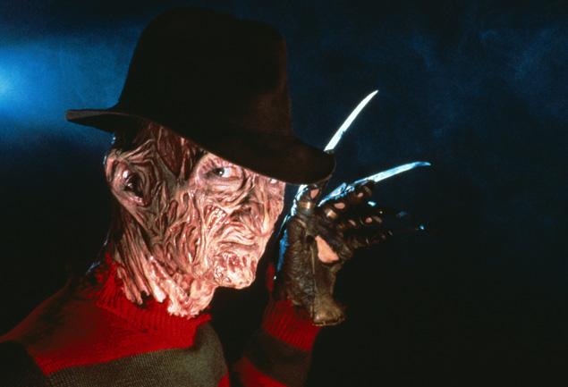 Freddy krueger is holding a knife in his hand.