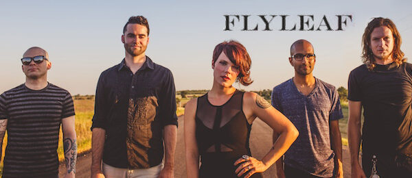 A group of people standing next to each other with the words flyleaf.