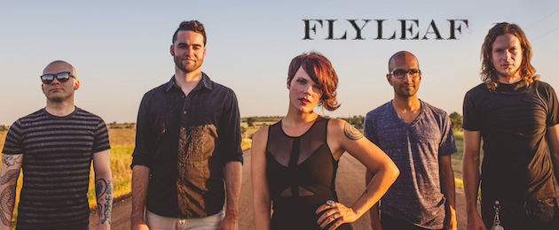 A group of people standing next to each other with the words flyleaf.