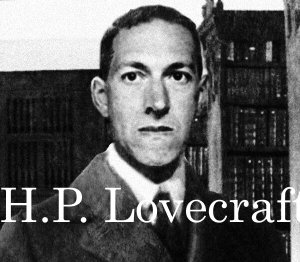 A man in a suit is standing in front of bookshelves with the words h p lovecraft.