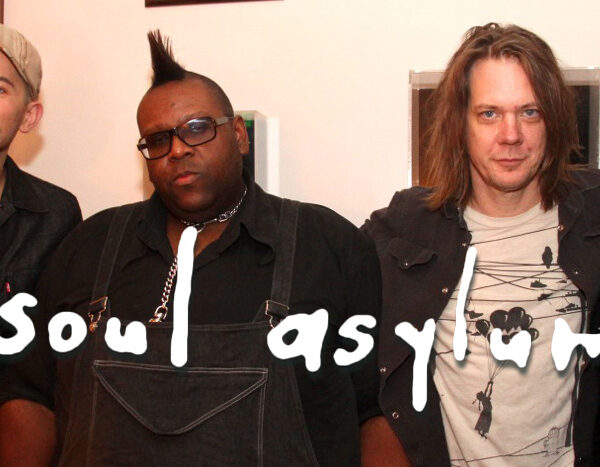 A group of men posing for a picture with the words soul asylum.