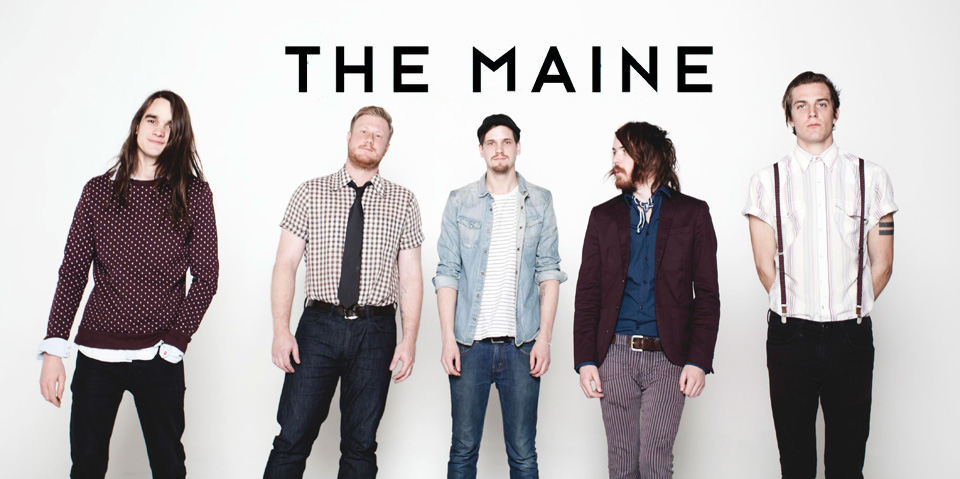 A group of men standing in front of a white background with the words the maine.