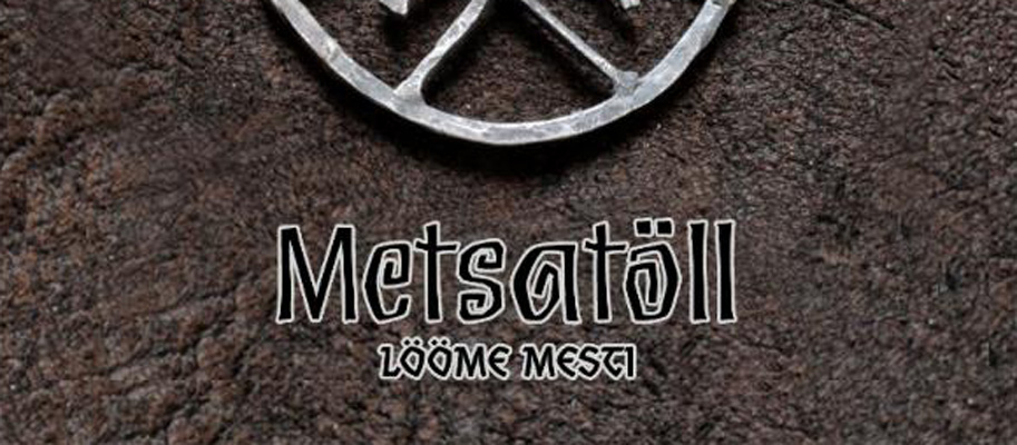 The logo for metsall on a piece of leather.