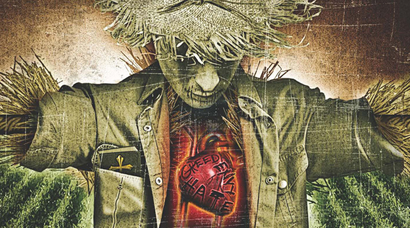 An image of a scarecrow holding a heart.