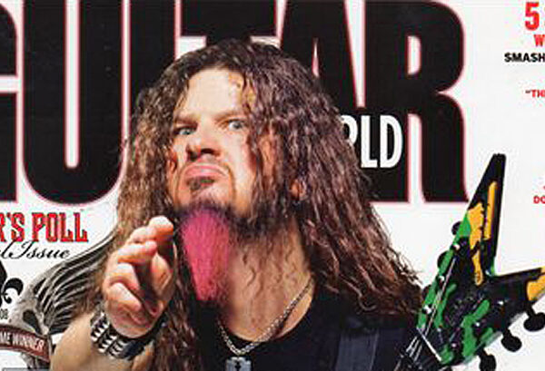 The cover of guitar world magazine featuring a man with long hair.