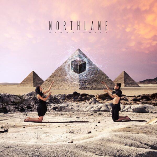 Two people standing in front of a pyramid with the words northlane.