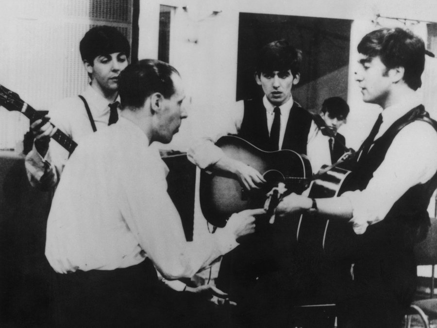 Producer George Martin in a recording session with The Beatles. Keystone/Getty Images