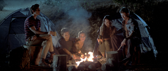 Around the campfire Riley (Thomas Ochoa), Derrick (John Omohundro), Hailey (Sydney Sweeeney) Selena (Tiffany Brouwer) and John (Paul Logan) horde