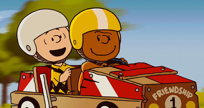 Charlie brown and Franklin in a race car.